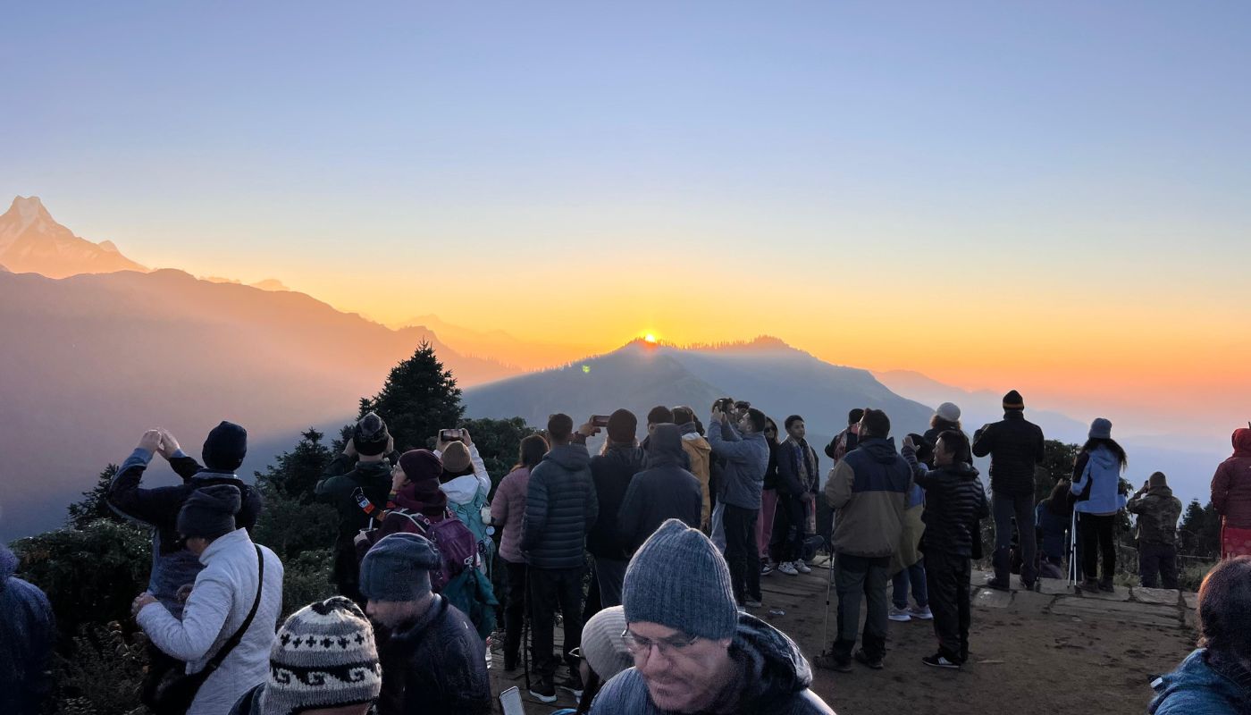 Trekkers gathered at Poon Hill viewpoint to watch the sunrise over the Annapurna and Dhaulagiri mountain ranges, on the Annapurna Circuit Trek.