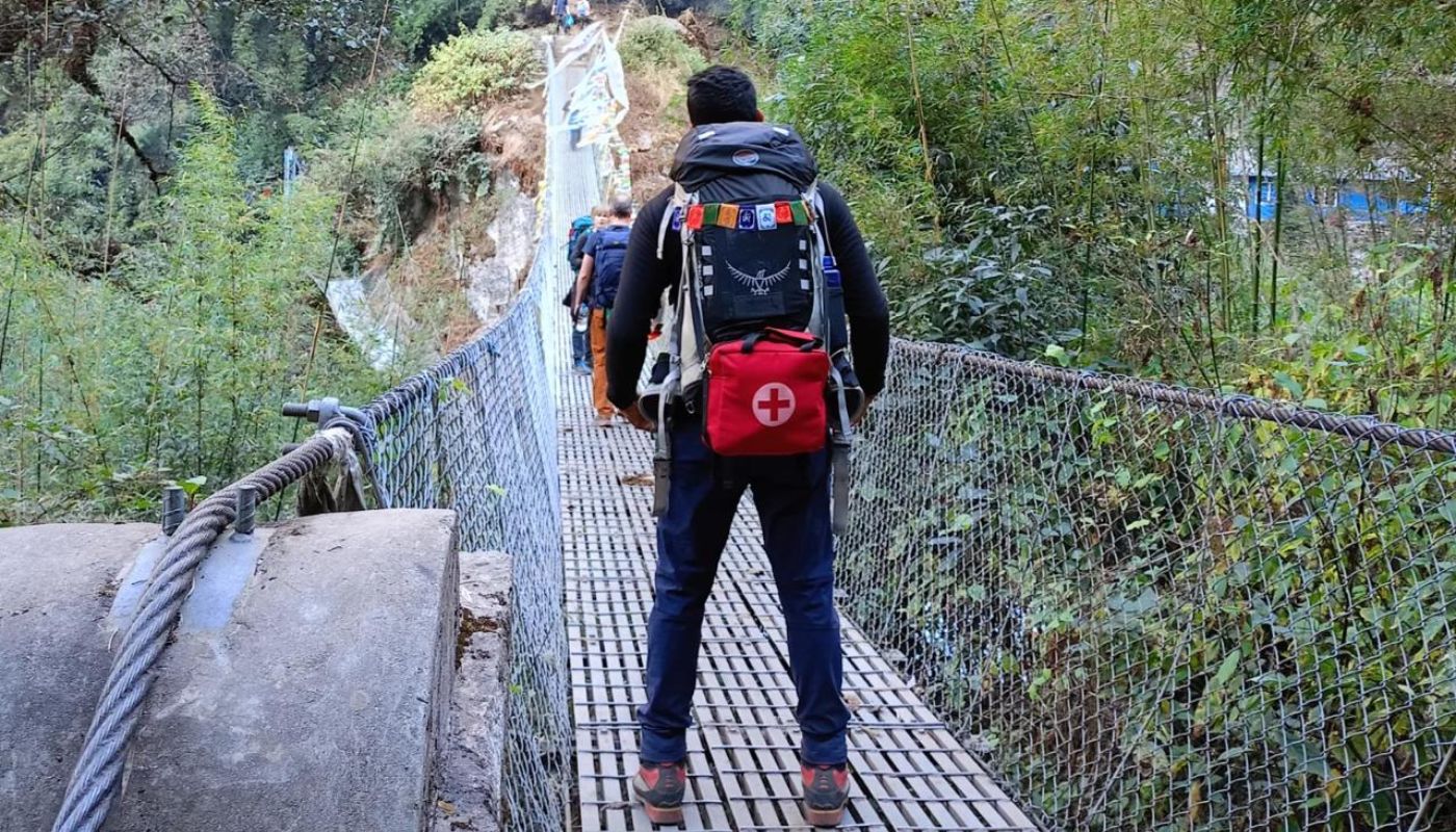 Nepal Hiking Adventure guide carrying first aid kit during Himalayan trek