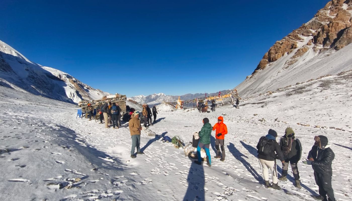 Trekkers crossing Thorong La Pass on the Short Annapurna Circuit Trek in Nepal during April